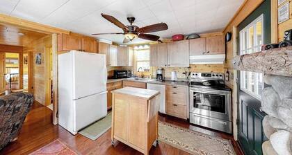 Lakefront home with dock, swimming area, & wood stove - sunset views