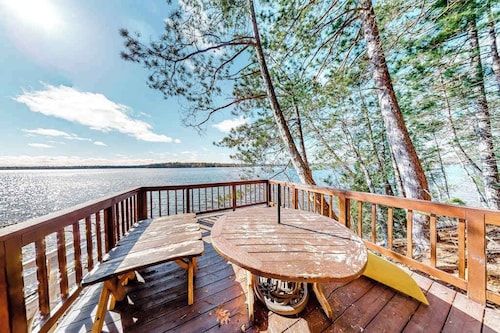 Lakefront home with dock, swimming area, & wood stove - sunset views