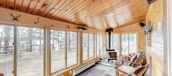 Lakefront home with dock, swimming area, & wood stove - sunset views