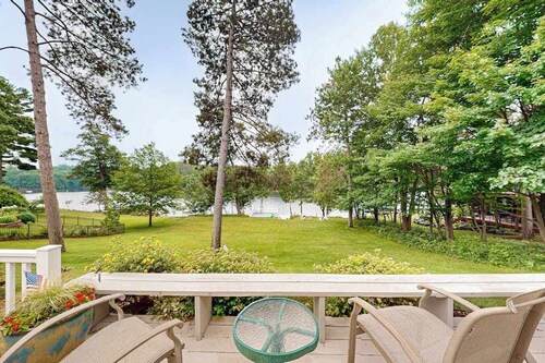 Gorgeous lakefront home with dock, sandy beach area, fireplace, huge deck & WIFI