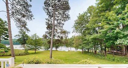 Gorgeous lakefront home with dock, sandy beach area, fireplace, huge deck & WIFI