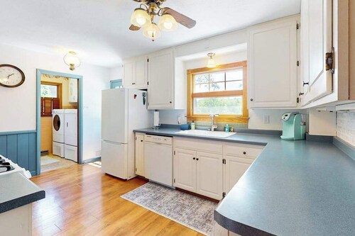 Gorgeous lakefront home with dock, sandy beach area, fireplace, huge deck & WIFI