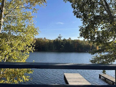Gorgeous lakefront home with dock, sandy beach area, fireplace, huge deck & WIFI