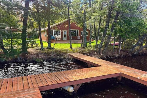 Dog-friendly lakefront property with dock, boat lift, firepit & hot tub