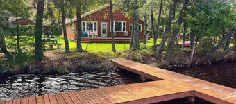Dog-friendly lakefront property with dock, boat lift, firepit & hot tub