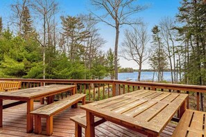 Outdoor dining - Lakefront home with firepit, large deck, & amazing views (St. Germain)