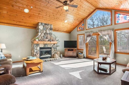 Riverfront golf resort condo with pool, hot tub, volleyball, & fairway-view deck