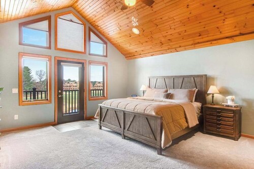 Riverfront golf resort condo with pool, hot tub, volleyball, & fairway-view deck