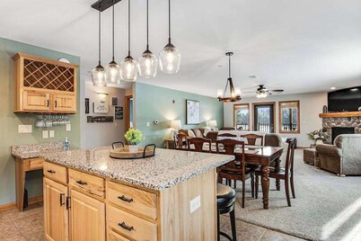 Condo at waterfront resort with golf course views, central AC, W/D, & pool