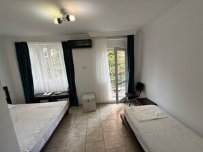 Quarto triplo conforto, sacada, vista para a montanha