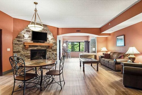 Serene river-view condo + perks + two fireplaces