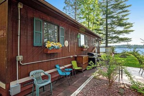 Terrace/patio - Two cozy, lakefront cottages w/ 2 docks, a patio, firepit, 2 gas grills, & WIFI (Eagle River)