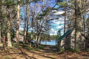 Property grounds - Peaceful, quiet lakefront dog-friendly cabin w/fishing dock, boats, campfire pit (Eagle River)