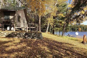 Property grounds - Peaceful, quiet lakefront dog-friendly cabin w/fishing dock, boats, campfire pit (Eagle River)