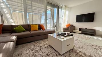 Chalet, 3 Bedrooms, Lagoon View | Living area | Flat-screen TV