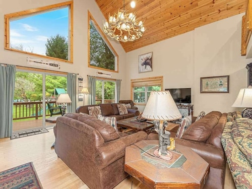 Lakefront home with private dock, firepit, playground & lake views