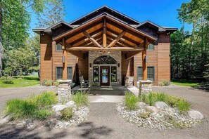 Exterior - Luxury lakefront home with high-speed WiFi, dock, private beach, & theater room (Eagle River)
