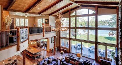 Luxury lakefront home with high-speed WiFi, dock, private beach, & theater room