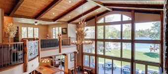 Luxury lakefront home with high-speed WiFi, dock, private beach, & theater room