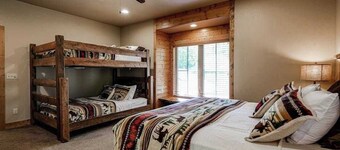 Luxury lakefront home with high-speed WiFi, dock, private beach, & theater room