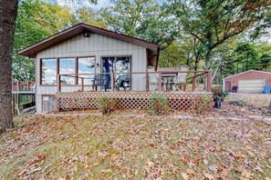 Outdoor dining - Peaceful river view home with a furnished deck, firepit, central AC, & WiFi (Wisconsin Dells)