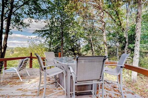 Outdoor dining - Peaceful river view home with a furnished deck, firepit, central AC, & WiFi (Wisconsin Dells)