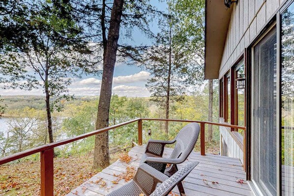 Terrace/patio - Peaceful river view home with a furnished deck, firepit, central AC, & WiFi (Wisconsin Dells)