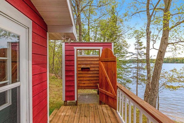 Terrace/patio - Updated home on private lake, two fireplaces, WiFi, W/D, & AC (Eagle River)