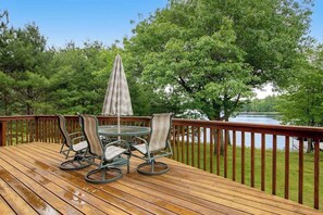 Outdoor dining - Dog-friendly lakefront getaway with dock, firepit, wet bar, game room, & AC (Eagle River)