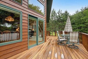 Outdoor dining - Dog-friendly lakefront getaway with dock, firepit, wet bar, game room, & AC (Eagle River)