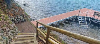 Charming lakefront home with dock, fireplace, streaming, lake views, W/D, & AC