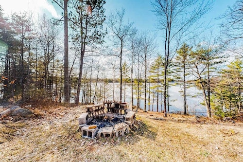 Quiet lakefront home with dock, canoe, & sunroom - dog-friendly
