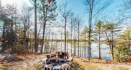 Quiet lakefront home with dock, canoe, & sunroom - dog-friendly