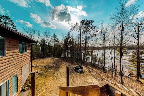 Quiet lakefront home with dock, canoe, & sunroom - dog-friendly