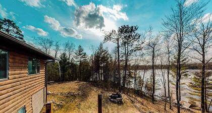 Quiet lakefront home with dock, canoe, & sunroom - dog-friendly