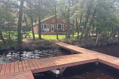 Dog-friendly lakefront cottage with private dock, firepit, grill & washer/dryer