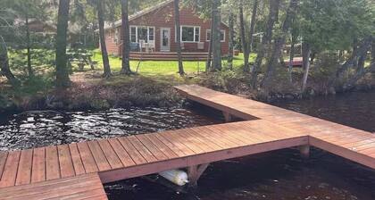 Dog-friendly lakefront cottage with private dock, firepit, grill & washer/dryer