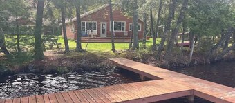 Dog-friendly lakefront cottage with private dock, firepit, grill & washer/dryer