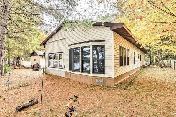 Exterior - Lakefront home with private dock, screened porch, woodstove, fast WiFi, & W/D (Rhinelander)