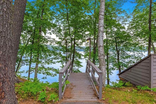 Snowy lake-view cabin with fireplace, full kitchen, TV, dock, & DVD player