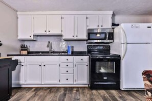 Fridge, microwave, oven, stovetop - Snowy lake-view cabin with fireplace, full kitchen, TV, dock, & DVD player (St. Germain)