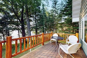 Outdoor dining - North Twin Lake Cabin w/ kayak, paddle boards, dock, gas grill, fire pit & WIFI (Phelps)