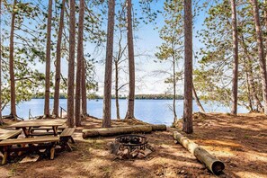 Outdoor dining - Remodeled Lakefront Cottage w/Free WiFi, Private Dock, Lake Views, & Gas Grill (Three Lakes)