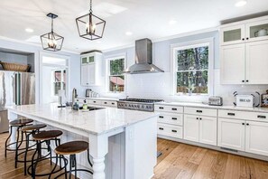 Fridge, microwave, oven, stovetop - Dog-friendly, lakefront house with beach access, dock, AC, W/D, patio, & firepit (St. Germain)