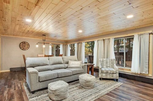 Renovated lake-view retreat with full rec lake access, boat slips, & firepits