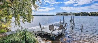 Charming lakefront home with shared dock, porch, & sunroom - walk downtown