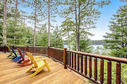 Lakefront log cabin on 3.5 acres with dock, gazebo & sunset views - dog-friendly