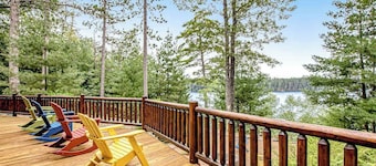 Lakefront log cabin on 3.5 acres with dock, gazebo & sunset views - dog-friendly