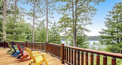 Lakefront log cabin on 3.5 acres with dock, gazebo & sunset views - dog-friendly