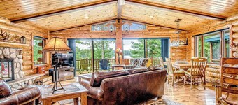 Lakefront log cabin on 3.5 acres with dock, gazebo & sunset views - dog-friendly